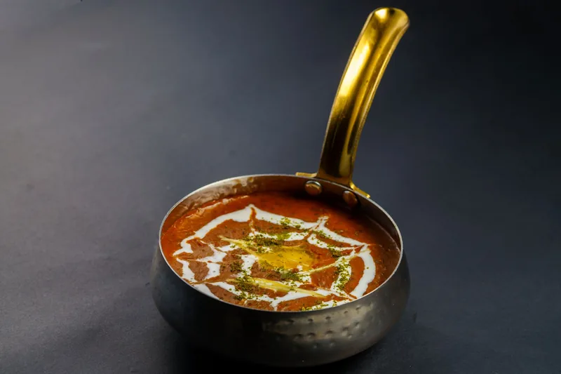 Dal makhani in a copper serving bowl